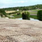 Brown shingle roof with a shingle surface upclose view